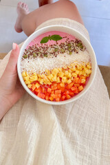 Healthy smoothie bowl with fresh fruits, seeds and coconut, perfect for nutritious breakfast.