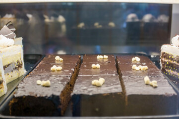 Chocolate cake slices in a bakery display