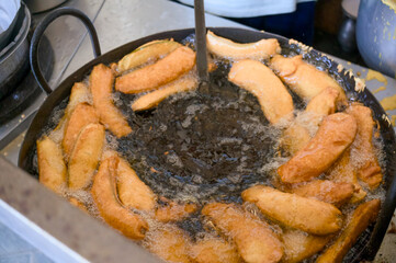 Delicious fried bananas being prepared in a kitchen