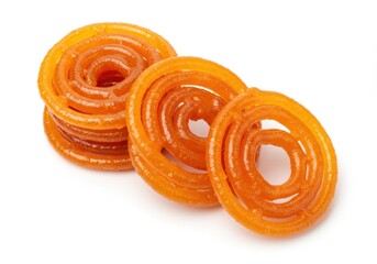 Fototapeta premium Stack of jalebi indian sweets on a white background, a popular dessert