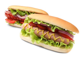 Tasty hot dogs with tomatoes, onions, lettuce and mustard on white background