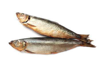 Two tasty smoked herrings on white background, top view
