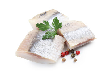 Pieces of delicious herring with parsley and peppercorns isolated on white