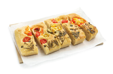 Cut delicious focaccia with flowers made of vegetables isolated on white