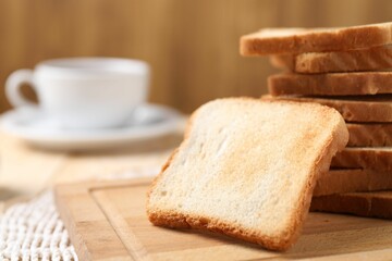Slices of tasty toasted bread on table, closeup. Space for text