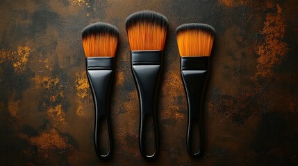 Three makeup brushes, various sizes