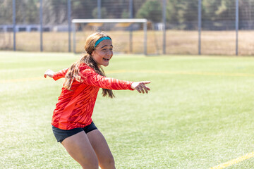 Girl soccer player. Girl in sports uniform on the soccer field. Football concept.