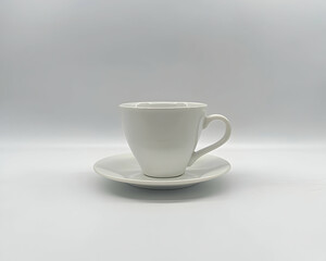 White coffee cup and saucer on a plain white background, perfect for cafe menus or website design