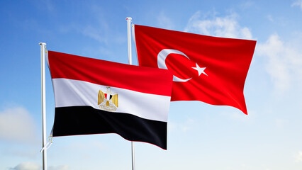flags of egypt and turkey over blue sky background.