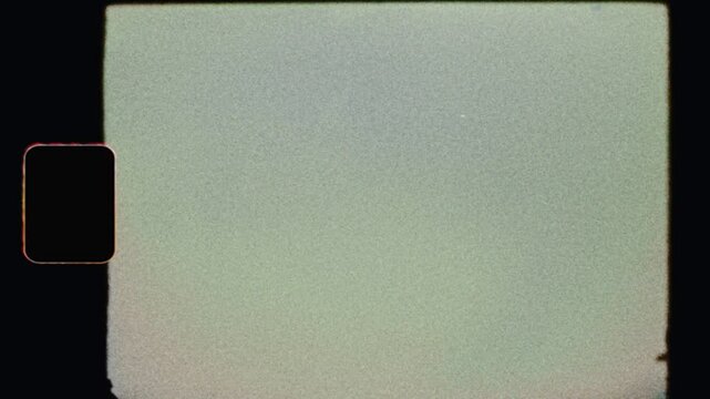 Raw Super 8mm Film Frame Scan with Sprocket Hole, Halation Shake, Grit & Heavy Grain (Super-8 Look) - film frame emulation with full analog character for overlay or retro vintage grunge transitions.