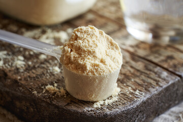 A scoop of whey protein powder - healthy nutritional supplement