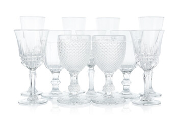 Many empty clean glasses isolated on white