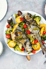 Baked dorado fish with asparagus and vegetables.