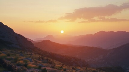 Obraz premium Majestic sunset landscape over rolling mountain ranges golden hour view sky red pink calm wild hills