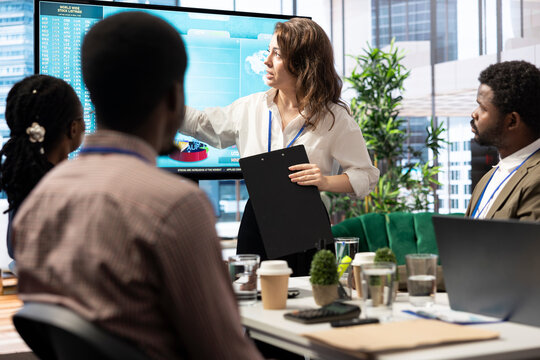 Business associates reviewing key performance indicators within the enterprise activity. Conducting evaluations and discuss training to foster professional development, enhance team efficiency.