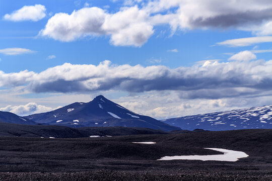 Icelandic rural mountain landscape with melting snow near Langjokull glacier, West Highlands,  Iceland