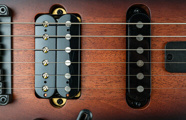 High-resolution photo of a meticulously crafted electric guitar, showcasing its pickups and strings...