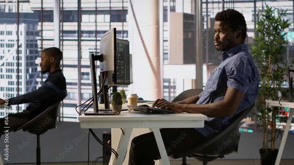 Poster african american man designing, developing and maintaining software applications using various progr