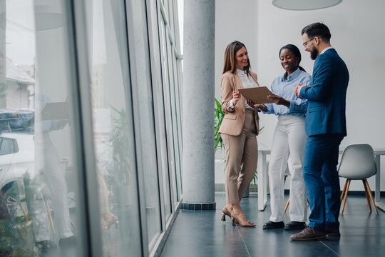 Business people discussing work in modern office building