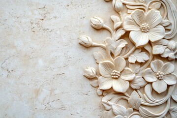 Ornate floral carving on a light beige stone surface.