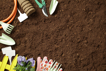Gardening tools and soil ready for spring planting