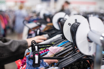 a genZ couple shopping in a thrift store