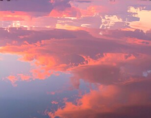 Fototapeta premium Stunning sunset reflected in calm water, creating a dreamy, colorful sky mirroring the cloudscape. Perfect for backgrounds, websites, or artistic projects.