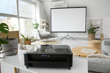 Modern video projector on shelf in room, closeup