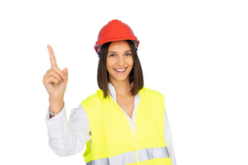 Smiling female engineer wearing safety vest and hardhat pointing her index finger up, isolated on transparent background