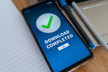 Download completed notification on smartphone app. Concept of downloading data and multimedia on...