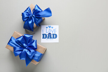 Postcard with gift boxes for Father's Day on white background