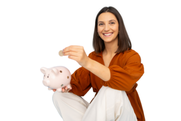 Young woman inserting a coin in a piggy bank, isolated on transparent background