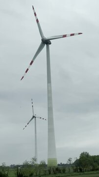 Wind turbines for green energy generation at dusk in Austria. High quality 4k footage