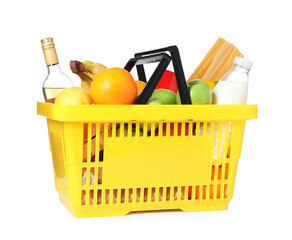 Shopping basket with different food products isolated on white