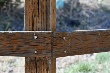 Fence post, corner piece, treated lumber, large nails.