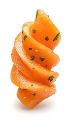 Spiral of vibrant orange vegetable slices, garnished with fresh herbs, isolated on white
