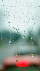 Raindrops on the windshield of the car