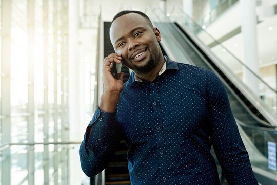Phone call, lobby and African businessman on escalator for commute, travel and arrival for conference. Professional, global worker and person in airport with smartphone for contact and networking - Powered by Adobe