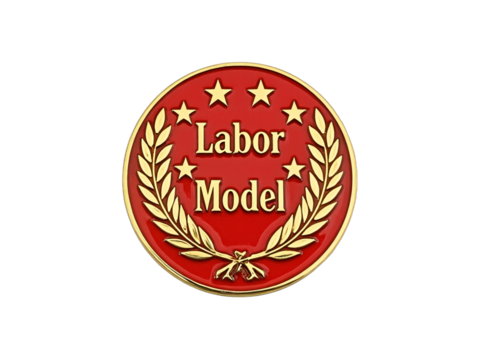Red and gold "Labor Model" round badge.