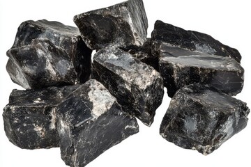Naklejka premium A collection of dark mineral rocks displayed on a clean surface, showcasing natural textures