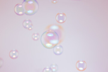 Beautiful Pink and Blue Soap Bubbles Floating in The Air. Celebration Festive Backdrop. Freshness Soap Suds Bubbles Water. Abstract Background.