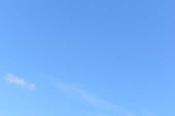 beautiful blue sky and white fluffy group of clouds with sunrise in the morning, natural background