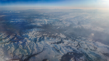 Majestic aerial view of snowy mountain landscape in winter