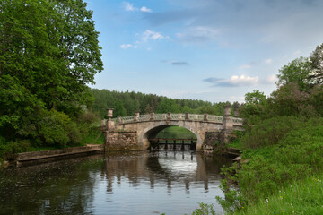 View of the Slavyanka River Valley and the Viscontiev Bridge in the Pavlovsk Palace and Park...