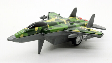 Green fighter plane toy isolated