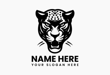 Bold black jaguar head silhouette with sharp contours, fierce vector logo for sports teams and outdoor brands