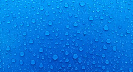 Water Droplets on Blue Surface Close-up
