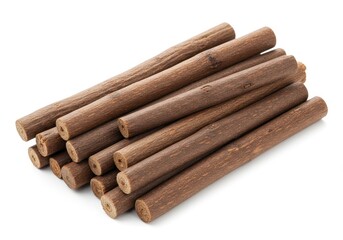 A pile of brown licorice sticks stacked on top of each other on a white background for a close up shot
