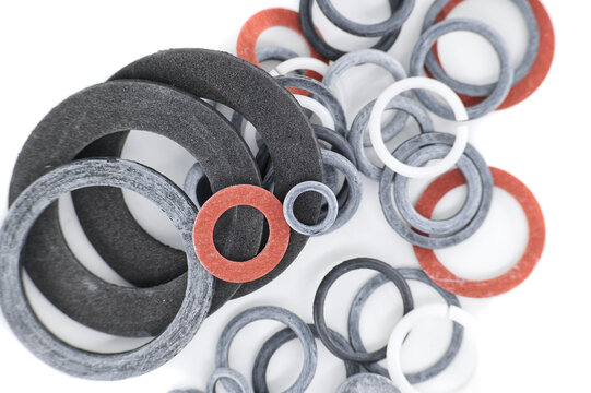 A detailed view showcasing an assortment of rubber and fiber gaskets in various sizes and colors.