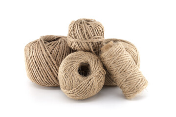 A collection of natural twine balls artfully arranged on a clean white surface.